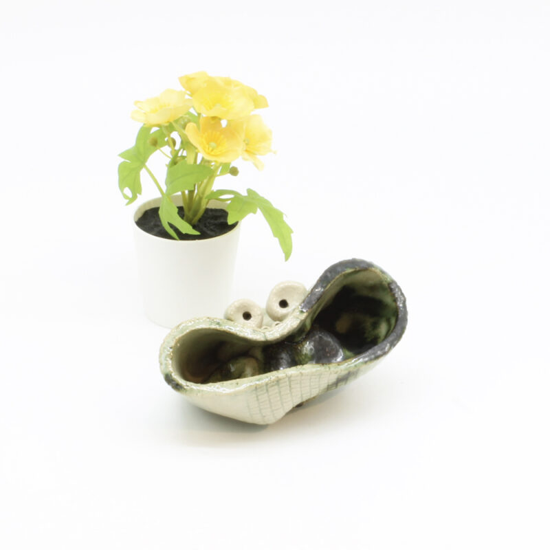 Det superglade krukkehoved. Skulptur af Finn Møller (11*7 cm)