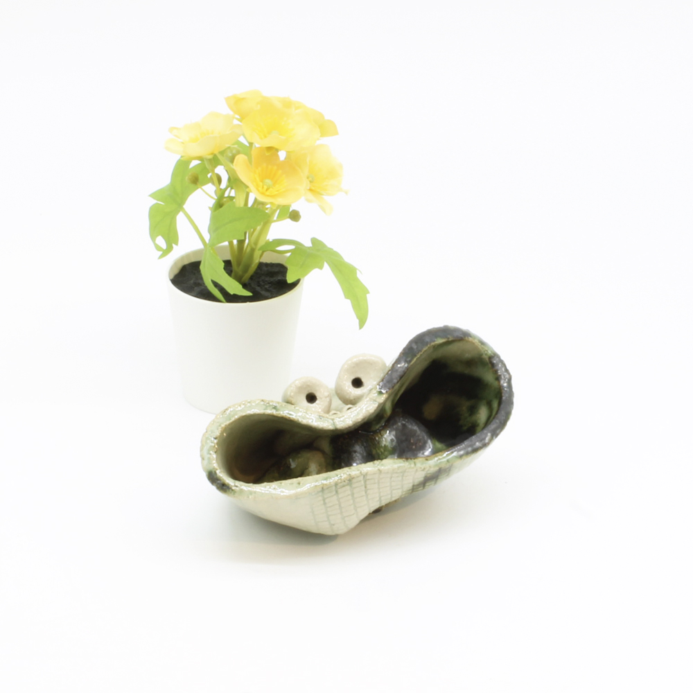 Det superglade krukkehoved. Skulptur af Finn Møller (11*7 cm)
